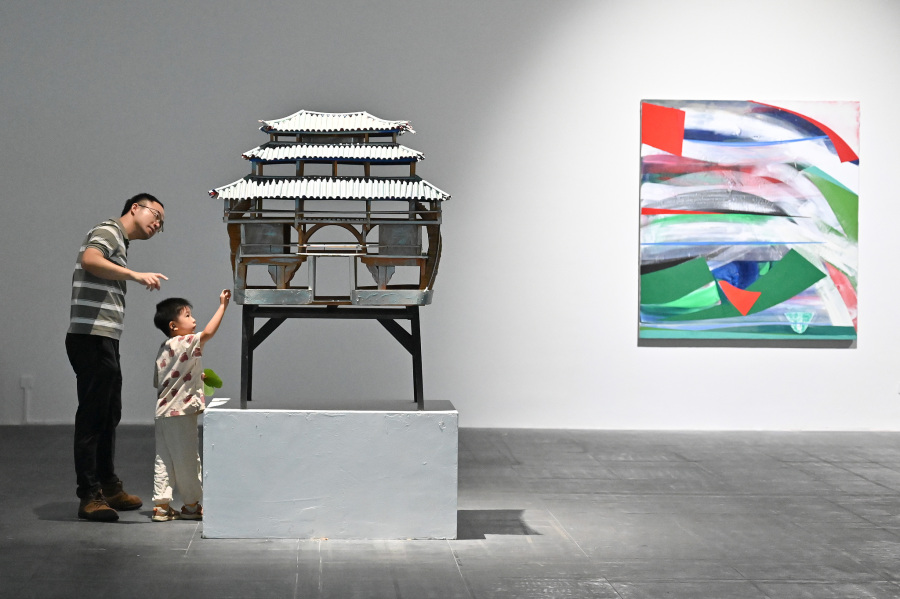 Visitors appreciate an exhibit at the 12th Euro-Asian Mediations Digital Art Biennale in Guangzhou, Guangdong Province, on September 13, 2026. /VCG